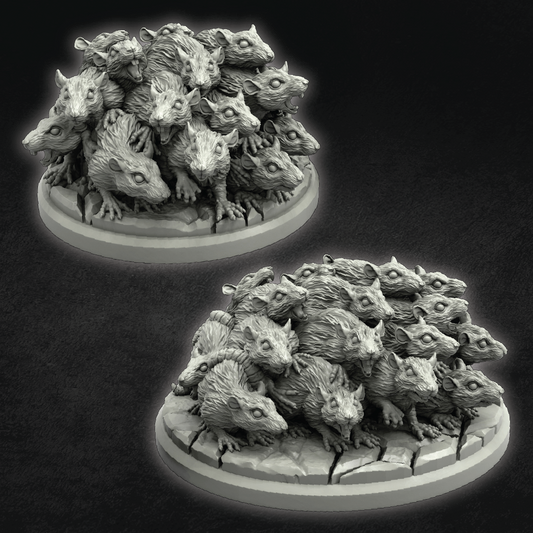 Two stacked models of small creatures on a dark background