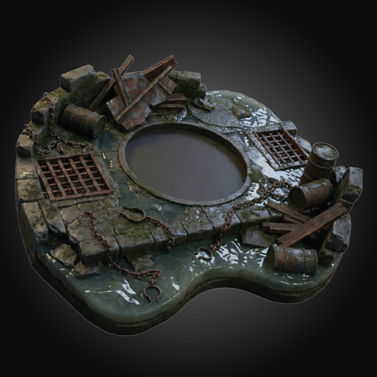 A highly detailed miniature terrain piece depicting a ruined stone platform with a central circular opening, surrounded by barrels, chains, and debris, set against a dark vignette background.