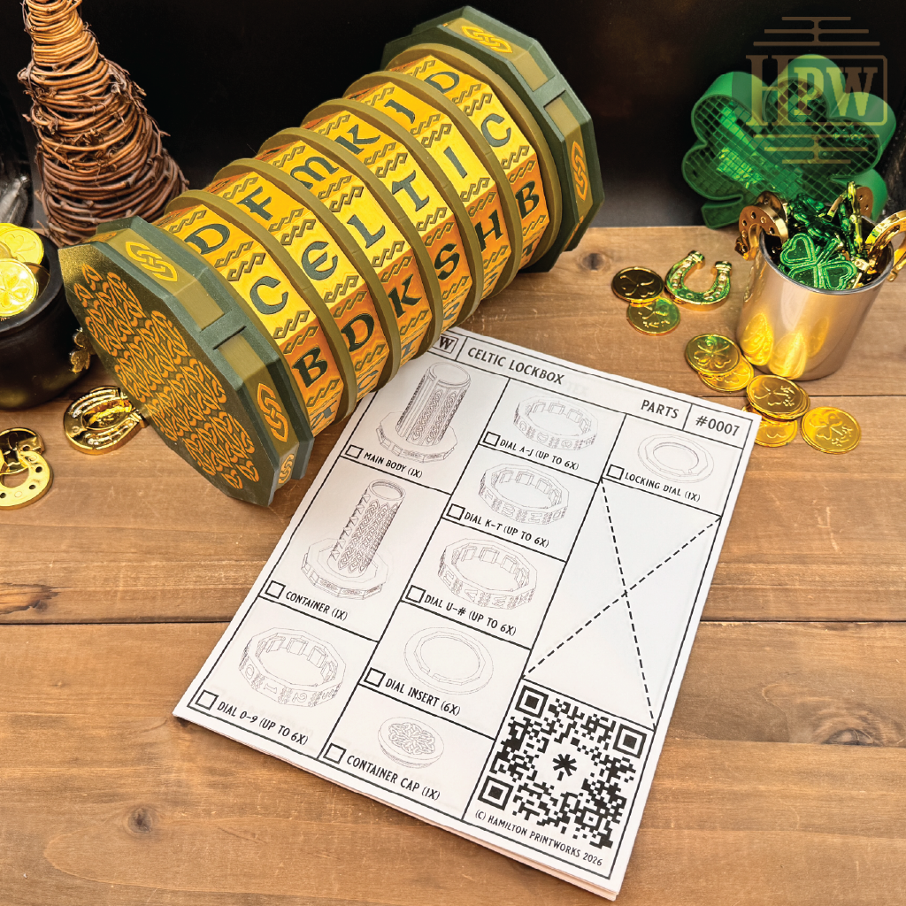 Celtic lockbox with gold coins and a diagram on a wooden surface