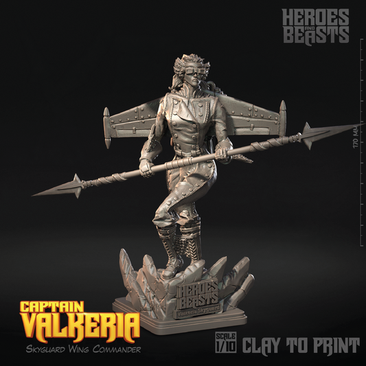 A 1/10 scale clay figurine of Captain Valkeria, a Skysguard Wing Commander from Heroes Beasts, shown in a matte gray unpainted resin. The winged female warrior holds a spear and stands on a rocky base with the Heroes Beasts logo.
