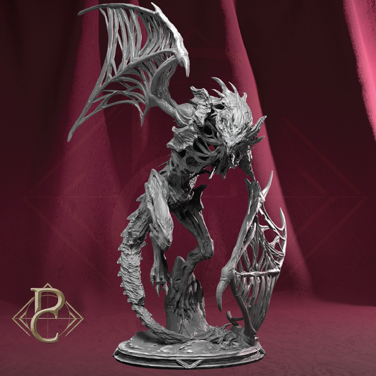 A detailed fantasy creature figurine or miniature statue with large bat-like wings, skeletal or organic textured body, glowing red eyes, and a circular base, photographed against a dark burgundy draped backdrop. A gold monogram logo appears in the lower-left corner.